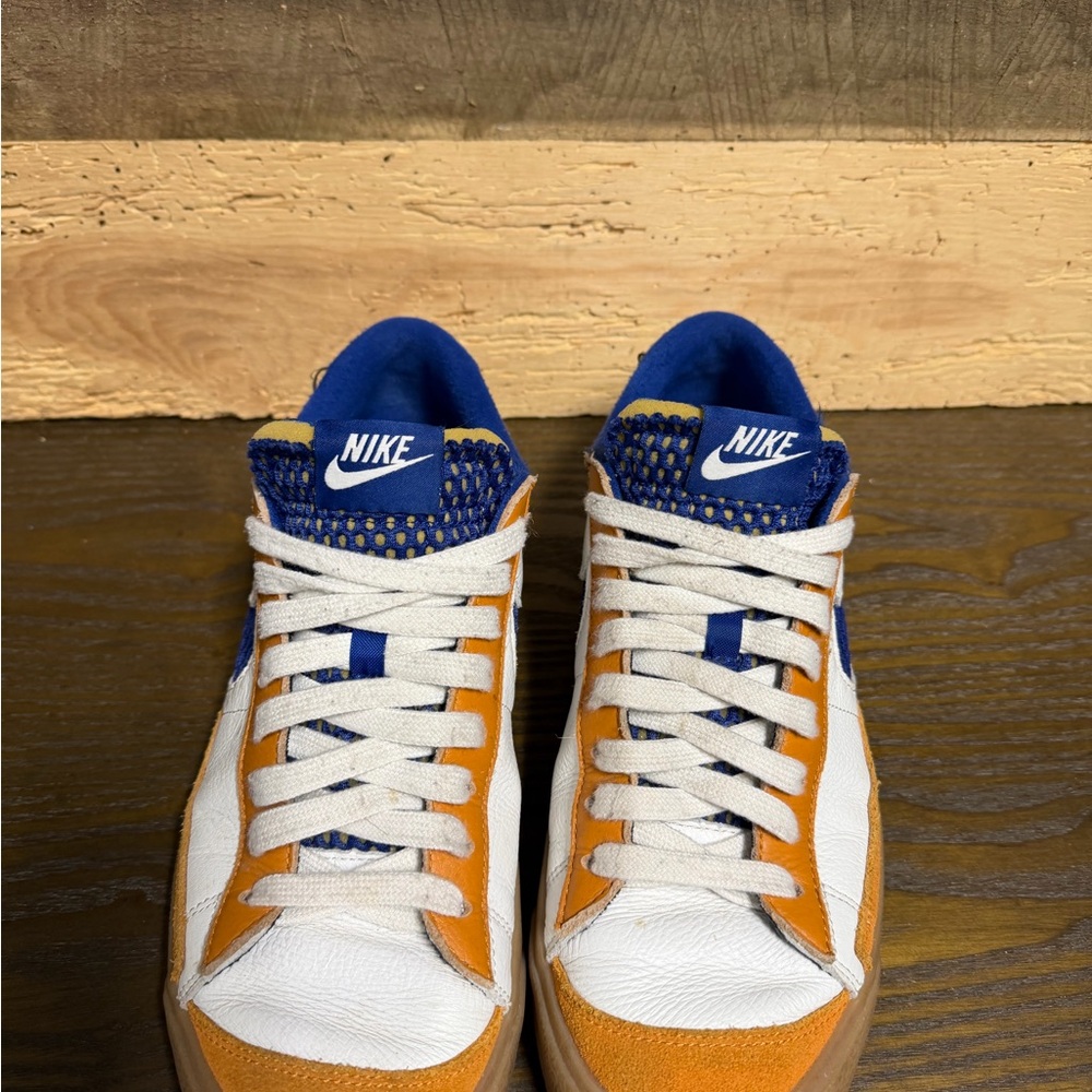 Nike Orange and White Sneakers with Blue Accents